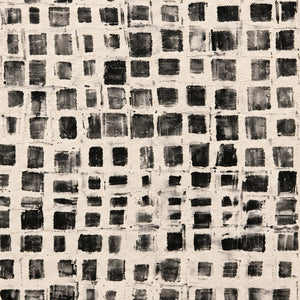 Close-up of uneven dark squares and overlapping cream grid lines.