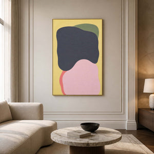 Minimalist charcoal and blush abstract wall art in a neutral living room.