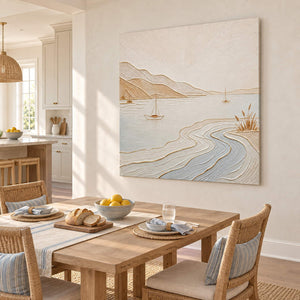 Pale coastal painting with sailboats, sandy hills, and curving wave contours without an outer frame in a breakfast dining area.