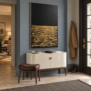 Night's Gentle Glow in a silver frame above a cream sideboard against a blue-gray entryway wall.