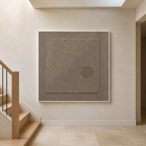Minimalist taupe artwork displayed above a warm limestone stair landing.
