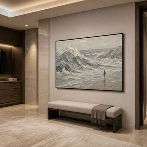 Neutral textured seascape wall art in a refined bathroom with a black frame.