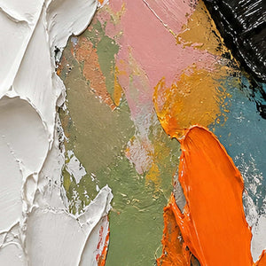 Close-up of raised hand-painted texture in warm tones, black, and white.