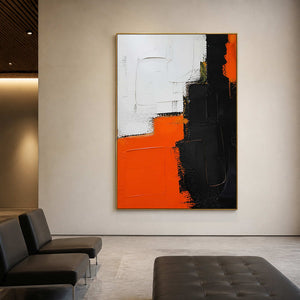 Textured orange and black canvas in a modern gallery lounge.