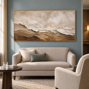 Hand-painted ivory, beige, and brown textured abstract canvas, displayed in a club lounge in a gold frame.