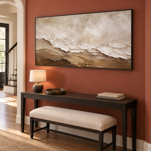 Hand-painted ivory, beige, and brown textured abstract canvas, displayed in an entrance hall in a black frame.