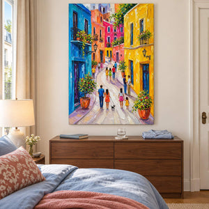 Colorful street painting with people, bright facades, and flowered balconies without an outer frame in a bedroom.