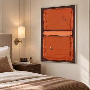Two-player tennis artwork beside a bed with brown bedding and a wall-mounted lamp.