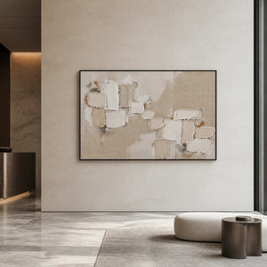 Large neutral textured abstract wall art displayed in an upscale hotel lobby.