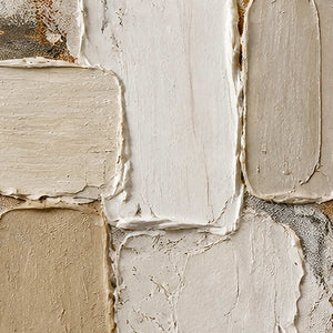 Close-up of raised ivory, cream, and taupe hand-painted block texture.