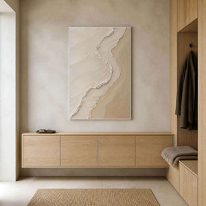 Minimalist sand and ivory wall art in a light oak entryway.