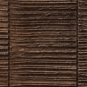 Close view of fine brown relief ridges with uneven edges and dark recesses.