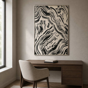 Silver framed abstract painting with flowing black lines above a home office desk.