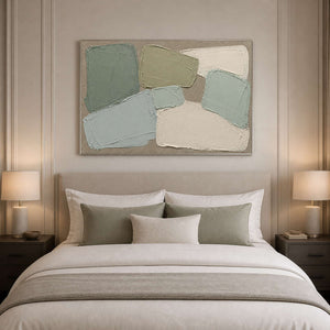 Sage and ivory abstract wall art styled above a neutral bed.