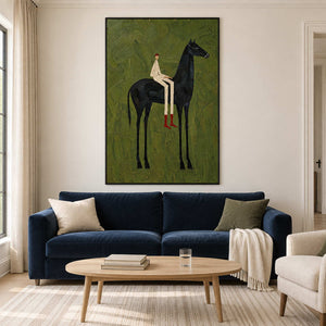 Vertical green rider painting above a dark blue sofa.