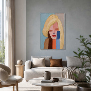 Expressive portrait artwork displayed above a pale contemporary living room sofa.