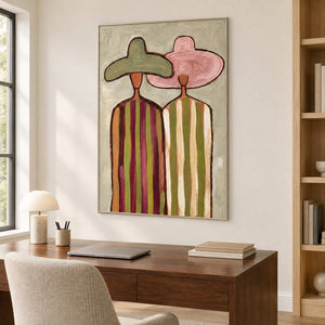 Companion portrait over a desk beside tall wooden shelving.