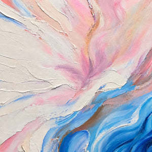 Close-up of raised cream and pink arcs meeting layered blue curves.