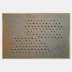 Horizontal relief artwork with raised circles in mist blue, gray, and ochre.