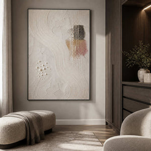 Textured ivory artwork displayed in a warm gray dressing room.