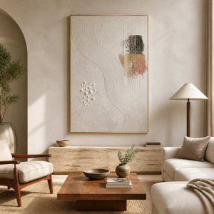 Textured minimalist wall art displayed in a warm travertine living room.