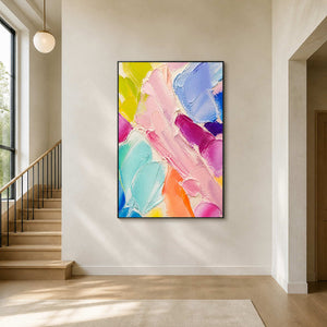 Vertical pastel abstract wall art creating a cheerful stair hall focal point.