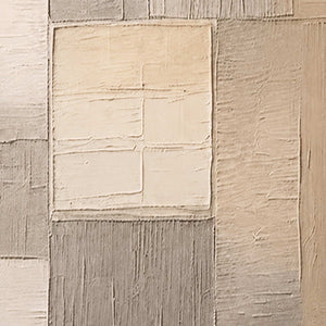 Close detail of raised cream rectangles and fine grooves across taupe patches.