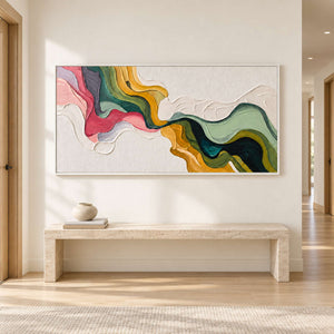 White-ground flowing abstract above a long pale bench in a bright hallway.
