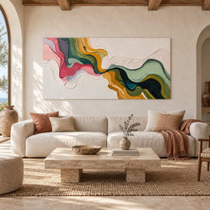 Pink-green flowing abstract above a cream sofa beneath wooden ceiling beams.