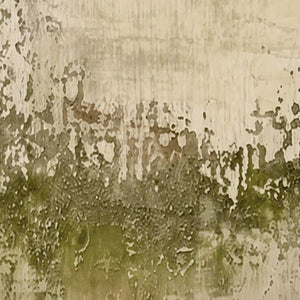 Close view of muted green underlayers emerging through irregular pale beige paint.