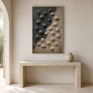 Textured pebble-form artwork above a limestone entryway console.