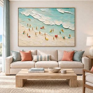 Textured beach painting with sea-glass waves and small beachgoers in a gold frame in a living room.