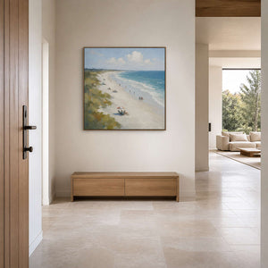 Coastal landscape wall art displayed in a warm ivory entry hall.