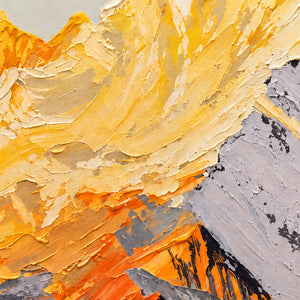 Close-up of raised cream, yellow and orange strokes crossing the mountain slopes beside a pale gray face marked with dark accents.