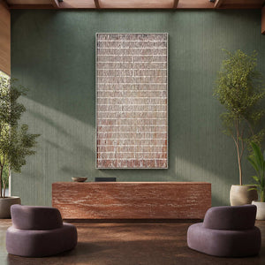 Silver framed woven grid artwork behind a wellness reception desk.