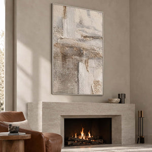 Neutral vertical abstract above a lit gray-beige fireplace beside a brown chair.
