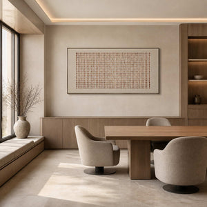 Minimalist textured grid artwork displayed in a modern office lounge.