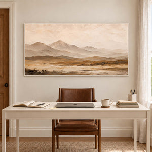 Soft taupe mountains above a muted ochre plain in a white frame, displayed in a home office.