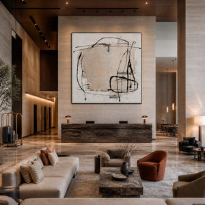 Large abstract wall art displayed above a reception desk in an elegant hotel lobby.