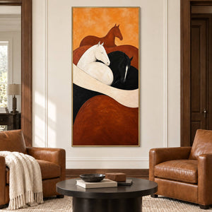 Brown, white, and black horse painting with cream and rust curves in a gold frame in a living room.