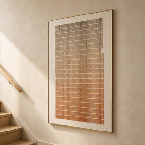 Textured terracotta wall art displayed beside a warm wood stairway.