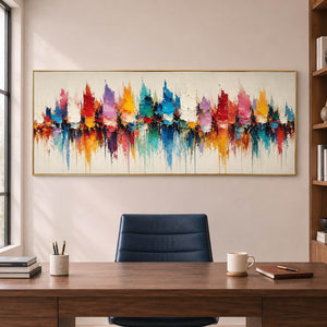 Panoramic harbor painting with colorful sail-like shapes and reflections in a gold frame in a home office.