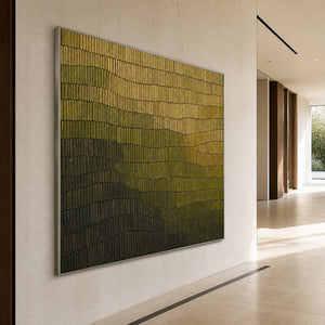Large square relief artwork along a bright contemporary hallway.