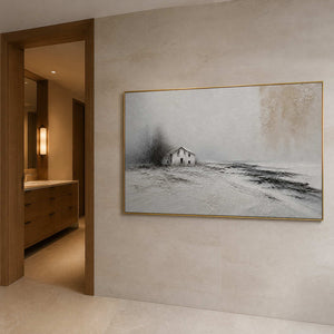 Horizontal ivory landscape wall art in a bathroom with a gold frame.