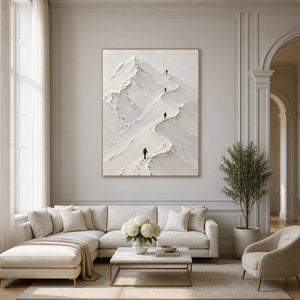 Textured white mountain wall art displayed in a warm double-height living room.
