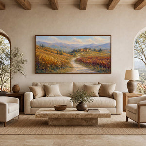 Tuscan landscape wall art displayed in a sunlit neutral villa living room.