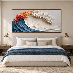 Textured wave over a cream bed with a navy throw and paired bedside sconces.