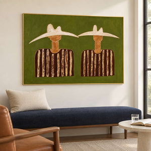 Angled two-hat painting above a navy upholstered bench.