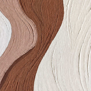 Close detail of curving grooves across white, muted blush, and brown texture.