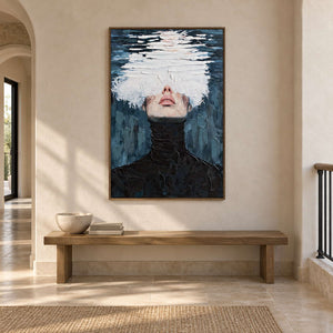 Cloudlike white portrait above a long wooden bench in an open hallway.
